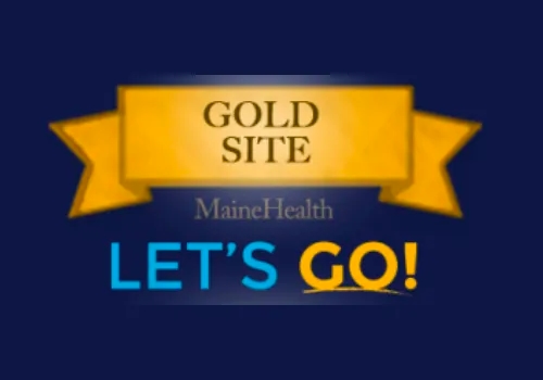 MaineHealth proudly displays its "Gold Site" recognition, encouraging everyone with a vibrant "LET'S GO!" message.