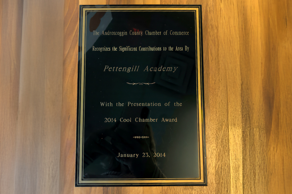 A plaque recognizing Pettengill Academy for the 2014 Cool Chamber Award from the Androscoggin County Chamber of Commerce.